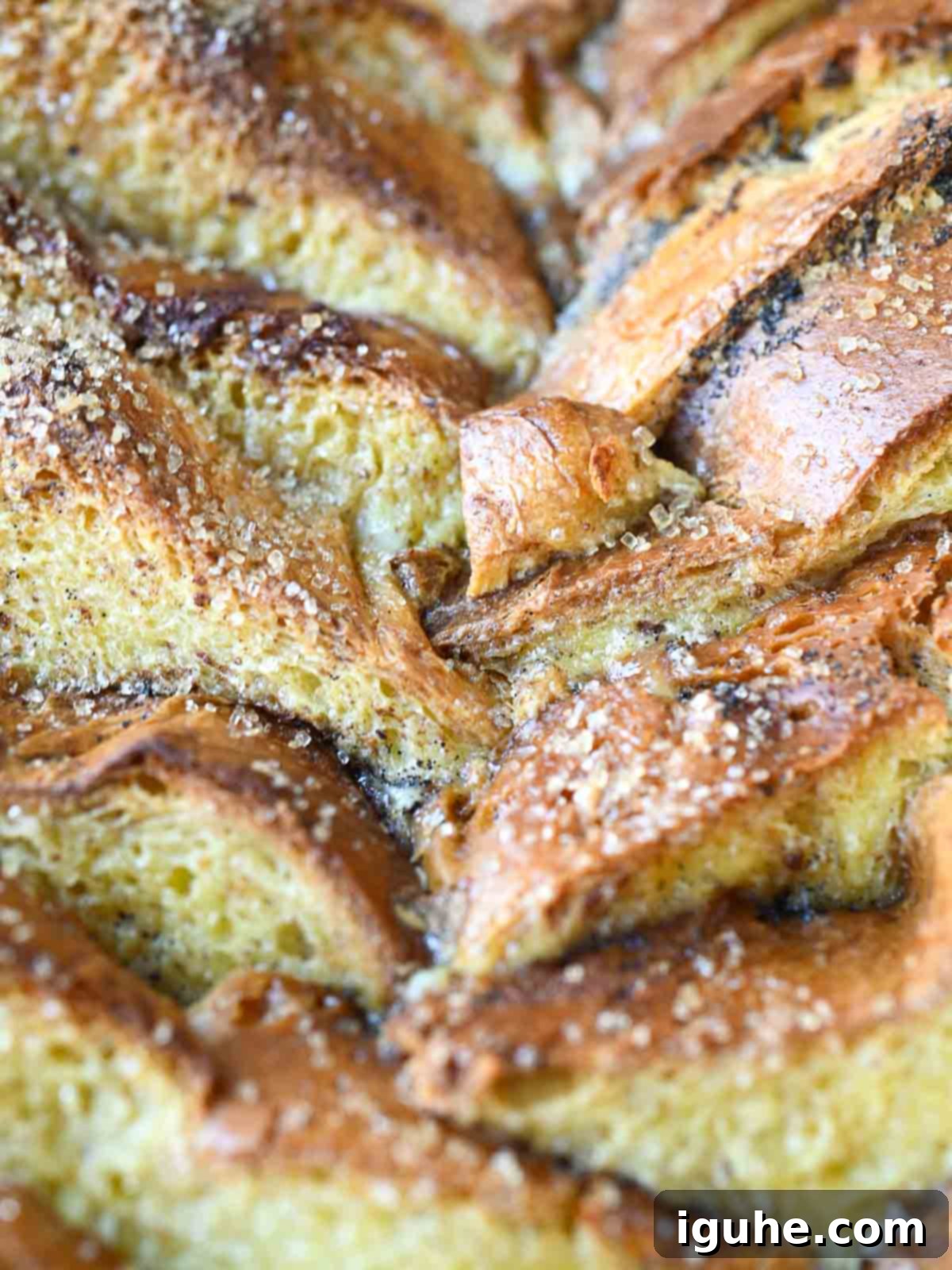 Decadent Baked Brioche French Toast 3 Close up of the top of French toast casserole, showing crispy edges.