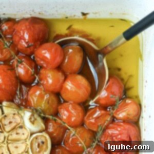 Cherry Tomato Confit with Garlic and Thyme 8 Overhead of cherry tomato confit in a baking dish.