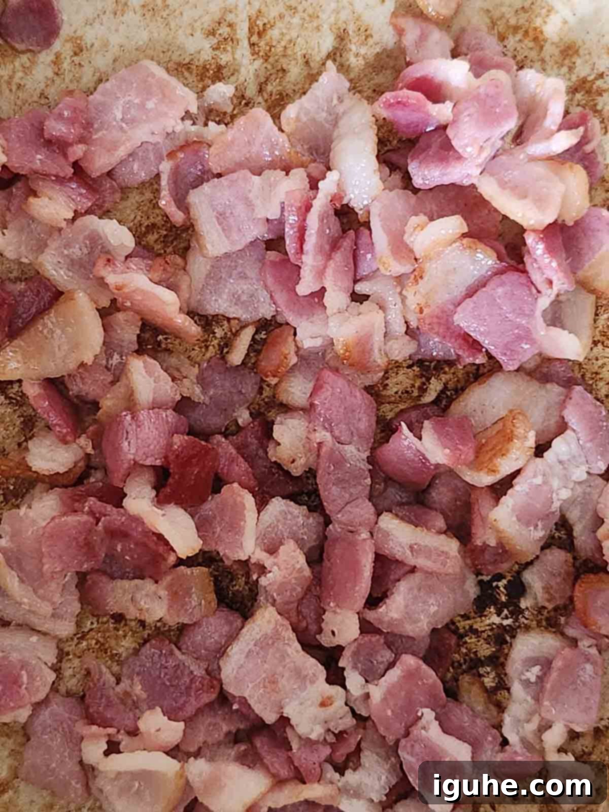 Hearty Bacon Lentil Soup 4 Chopped thick-cut bacon browning and sizzling in a large pot, indicating the first step of building flavor for the bacon lentil soup.