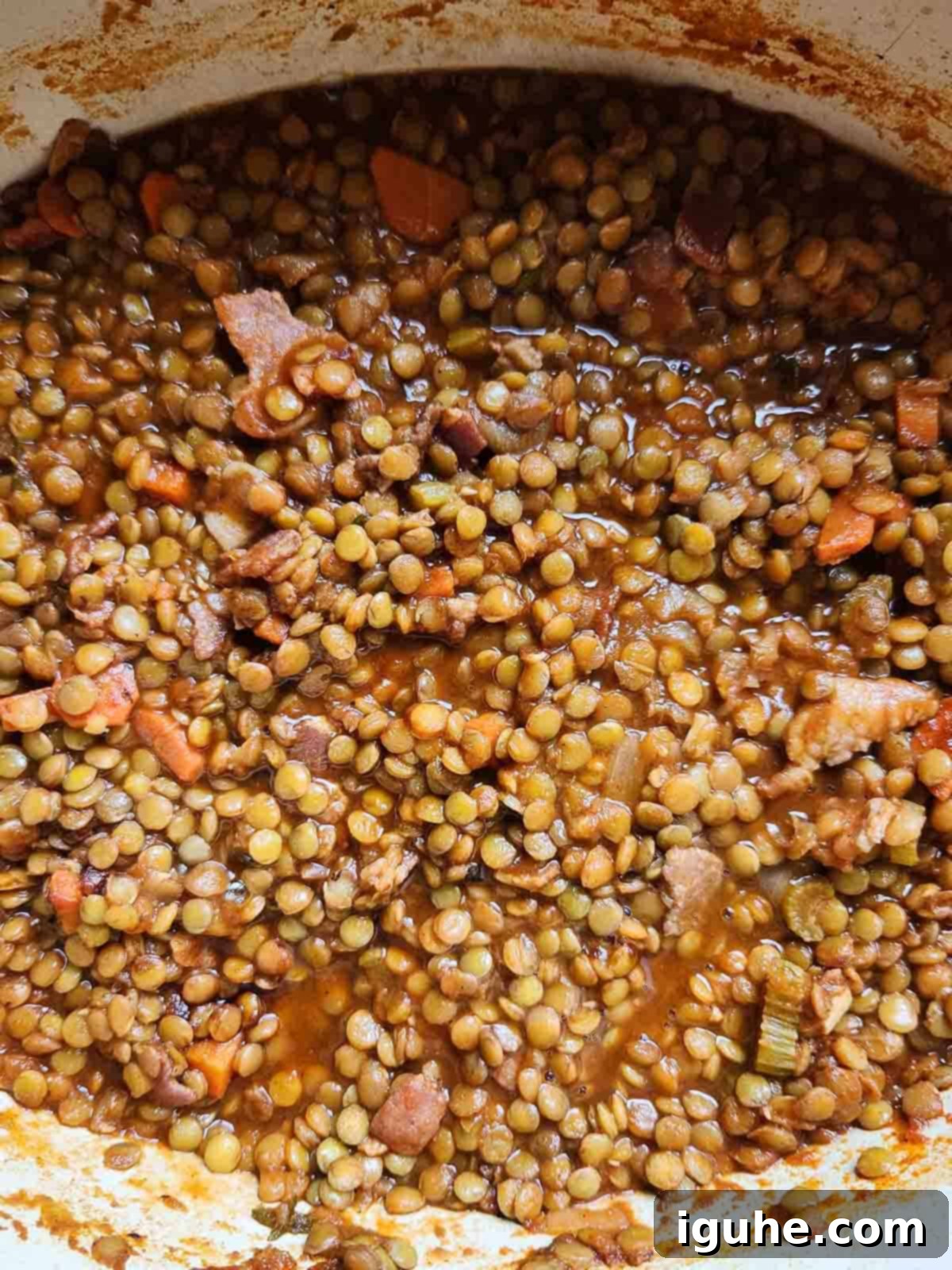 Hearty Bacon Lentil Soup 9 Overhead view of a finished pot of bacon lentil soup, rich and thick, ready for final seasoning and serving, showcasing its hearty texture.