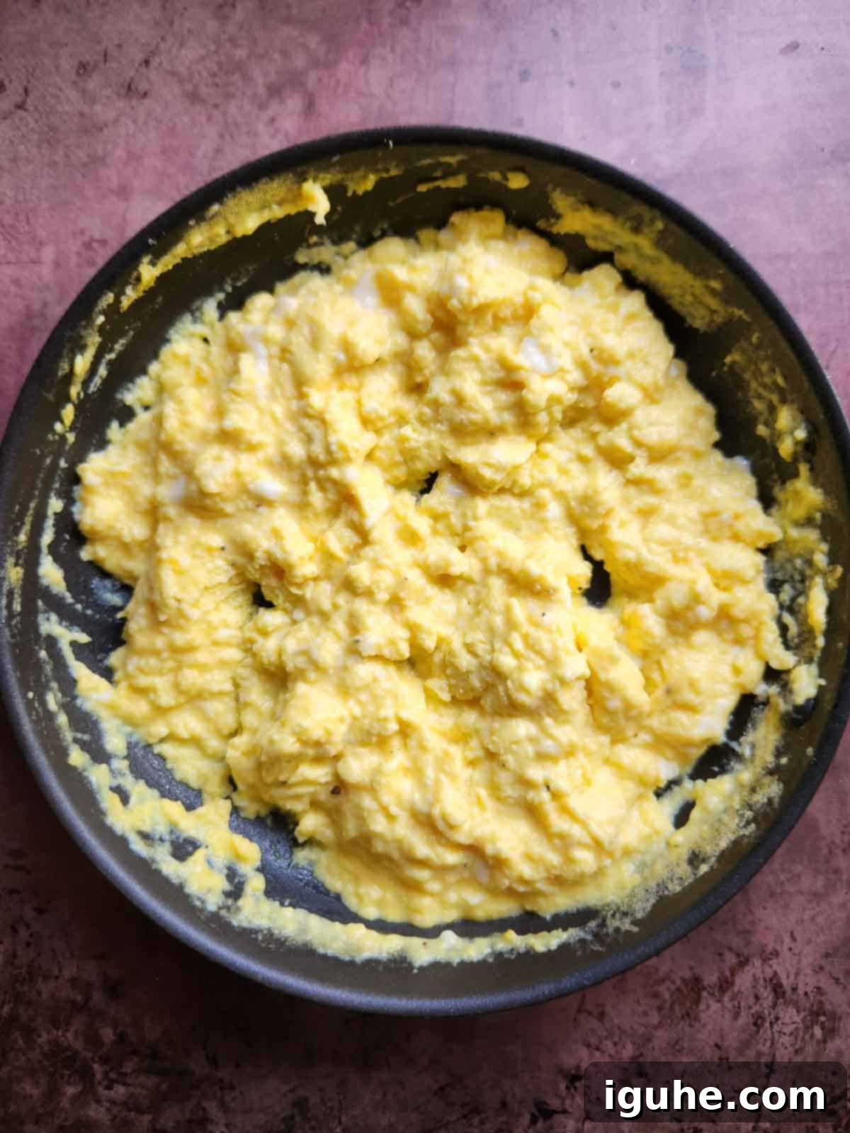 The Ultimate Buttermilk Scramble 7 Cooked scrambled eggs in a pan.