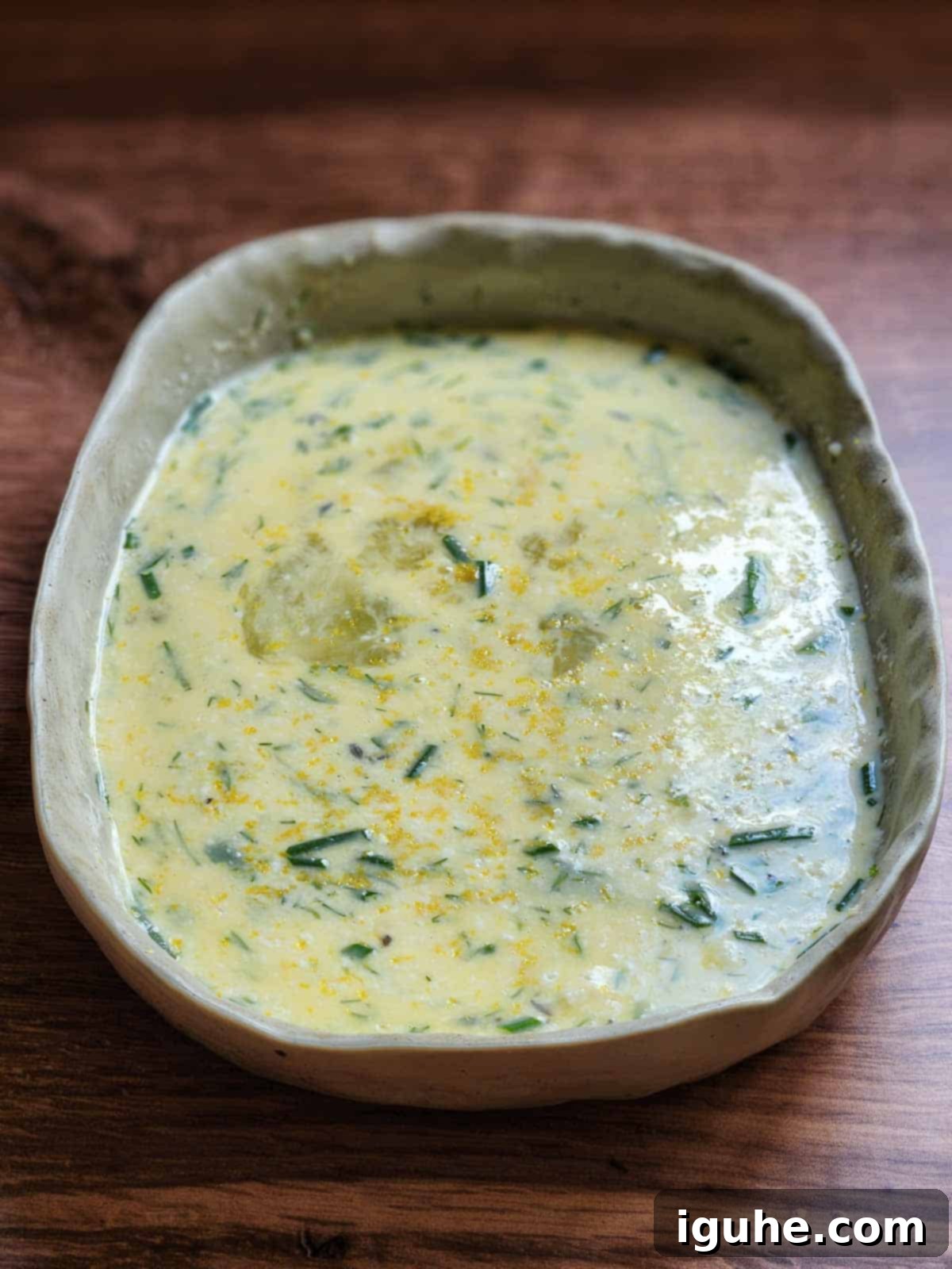 Parmesan, Lemon and Herb Savory French Toast 5 Mixed French toast custard in a rectangle dish.