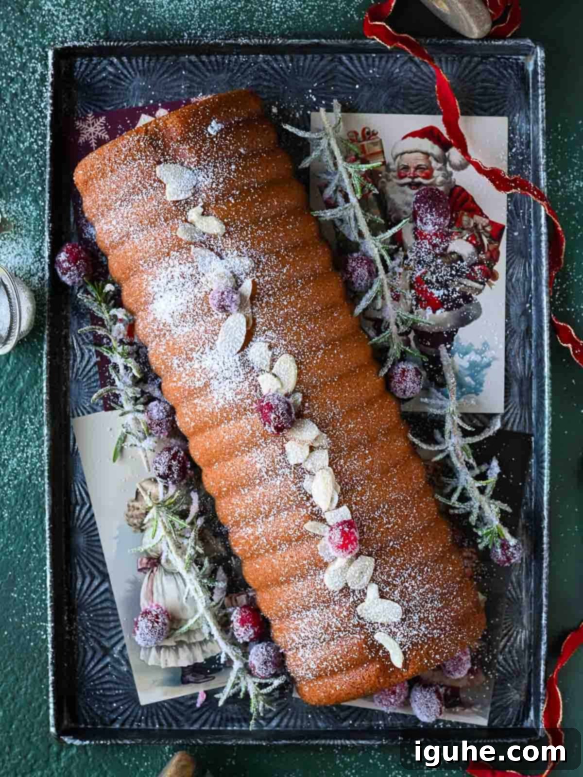 Overhead of an almond cake on a silver tray. Showing a simple and elegant way to serve your Scandinavian almond cake.