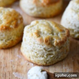 Cake Flour Biscuits 8 A close up image of a golden brown cake flour biscuit on a cutting board.