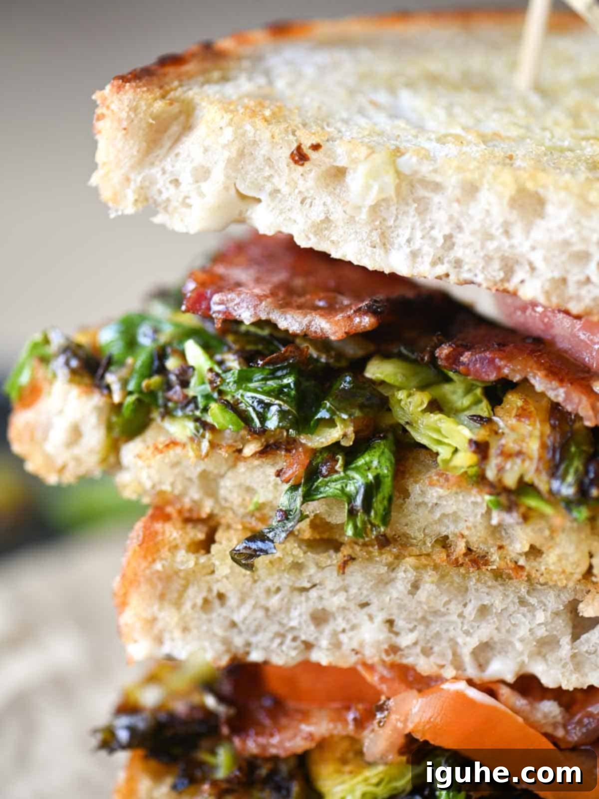 Crispy Brussels Sprout BLT 6 Close-up of Brussels sprouts tucked in a sandwich.