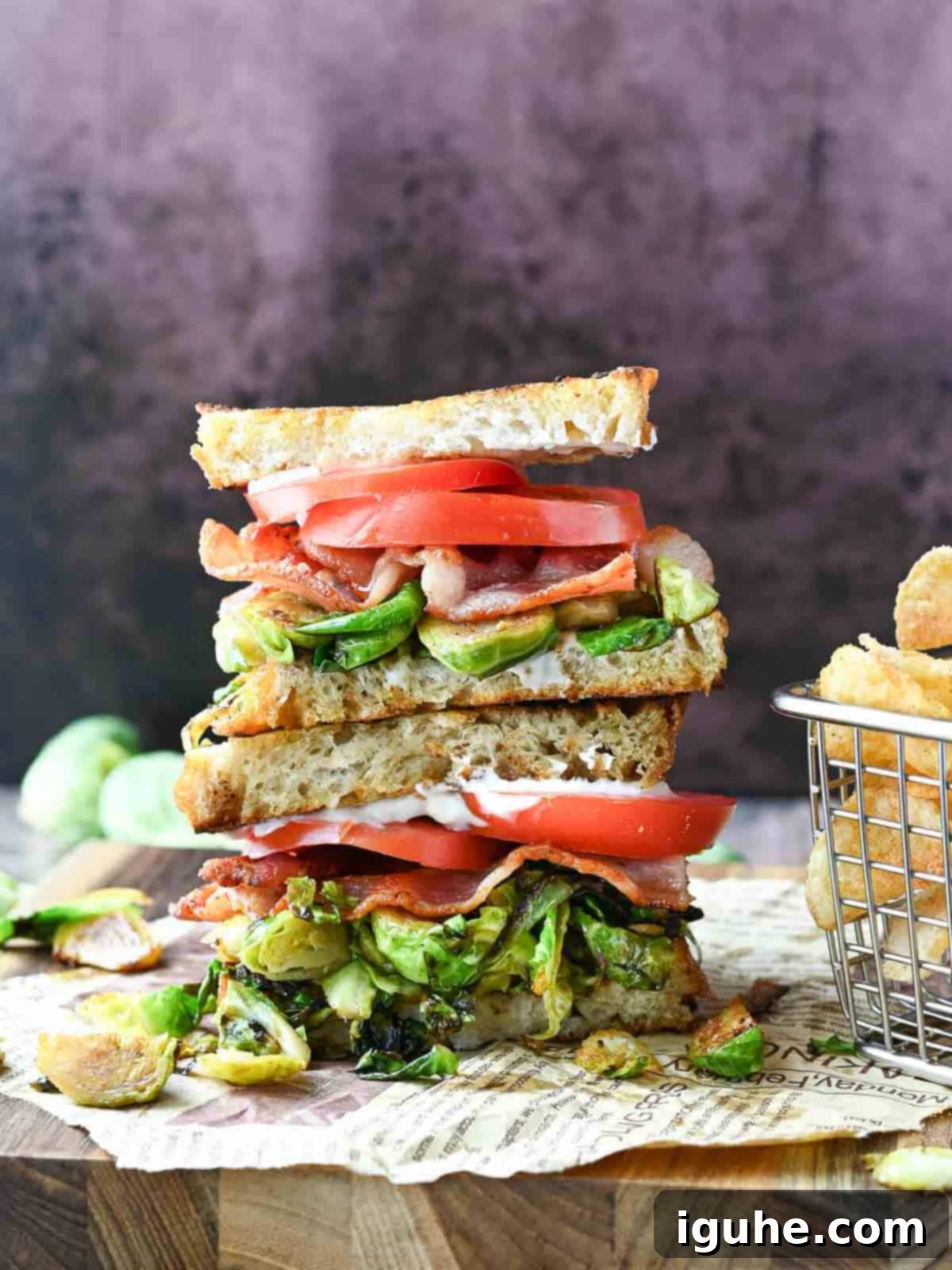 Crispy Brussels Sprout BLT 7 Two BLTs stacked on top of each other with brussel sprouts and potato chips.