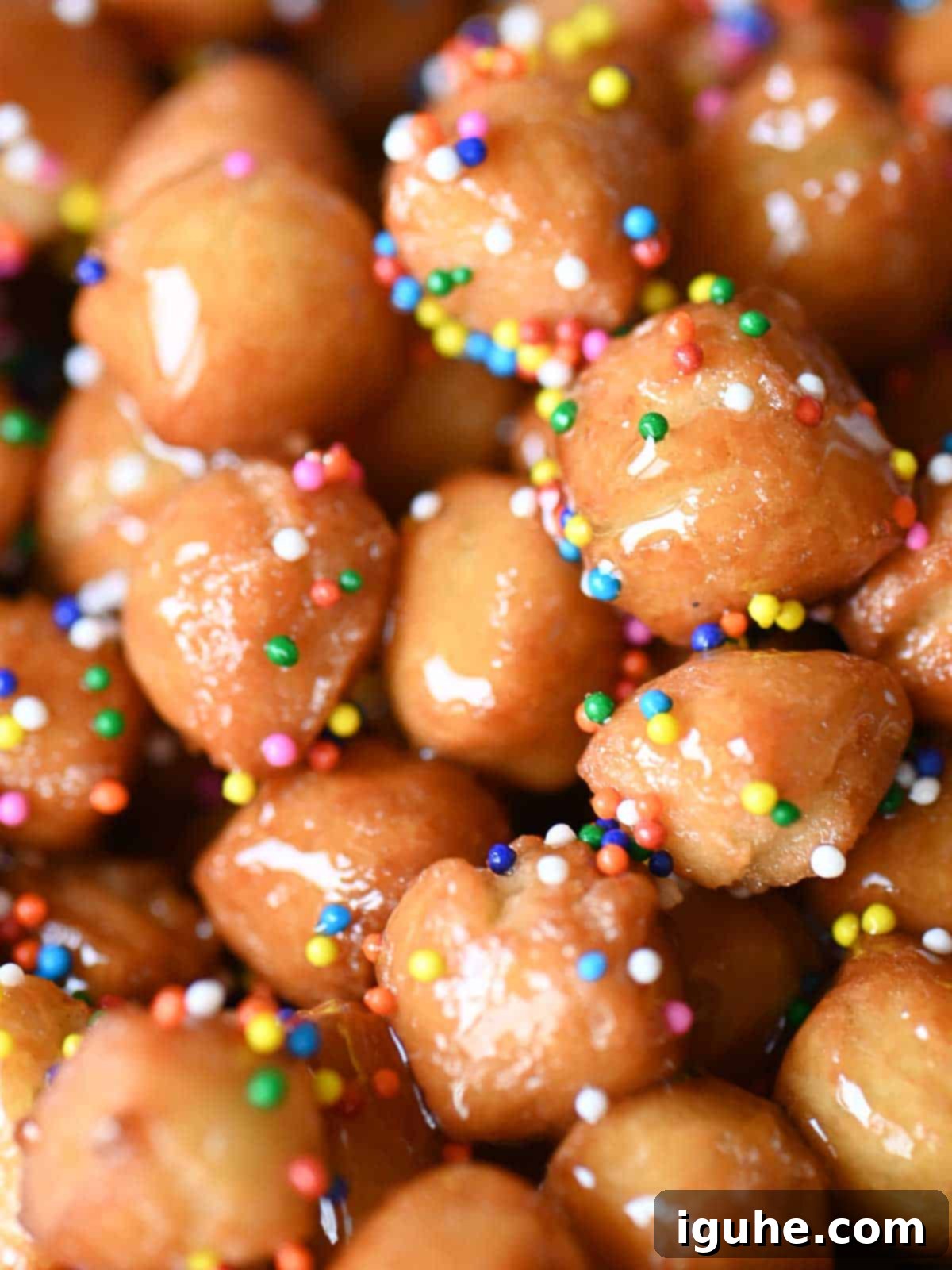 Honey-Drizzled Italian Dough Balls 3 A tantalizing close-up showcasing the golden, honey-glazed surface of Italian honey balls.