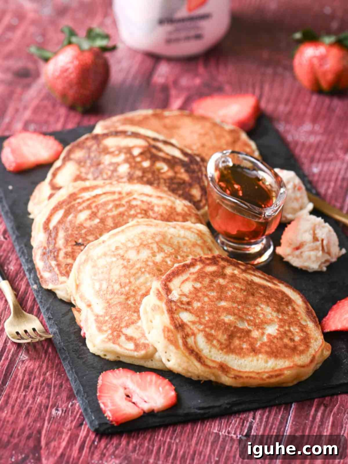 Strawberry Kefir Pancakes
Berry Bliss Kefir Pancakes 5 An array of mouthwatering strawberry pancakes arranged on a sleek black platter.