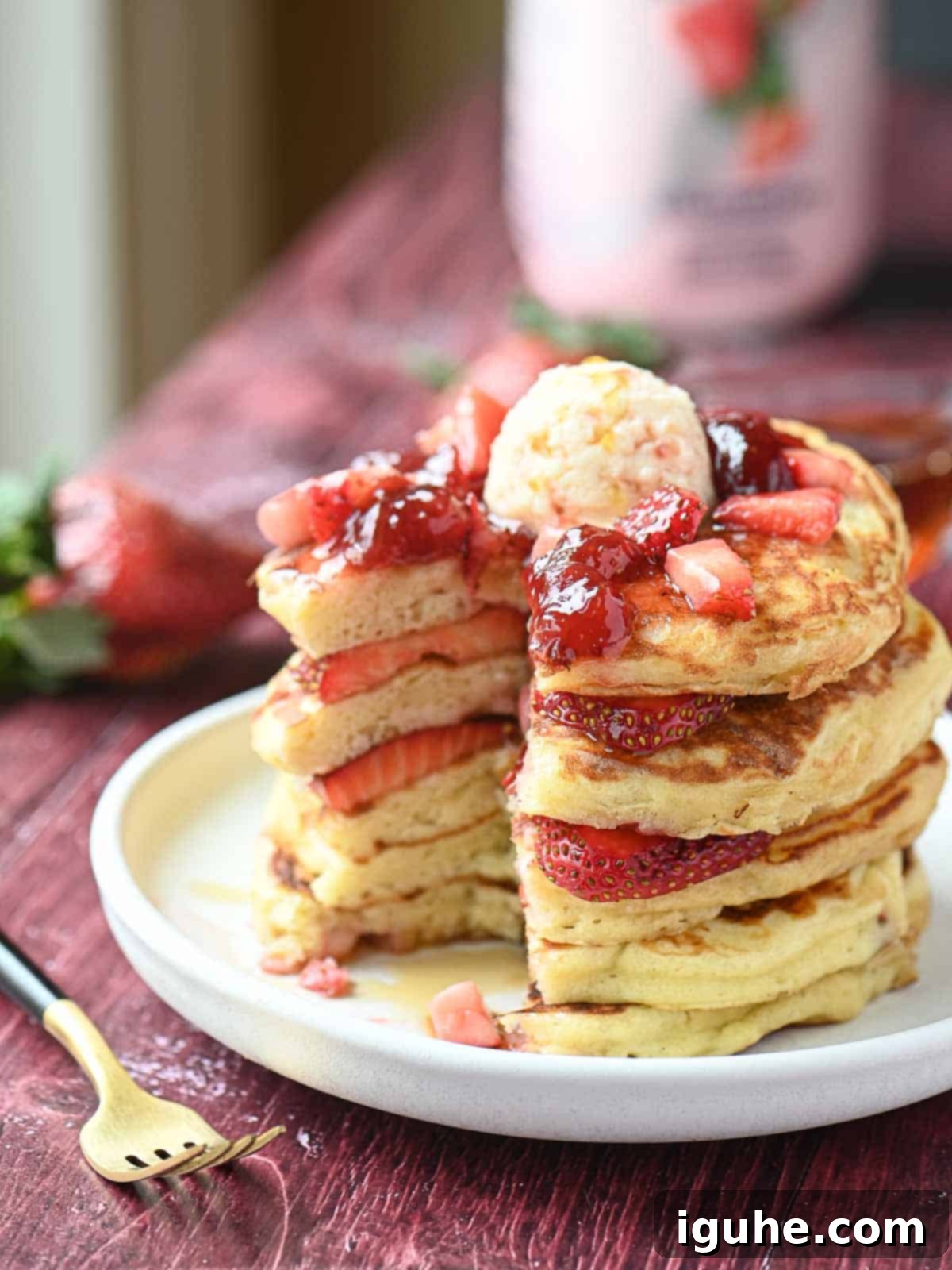 Strawberry Kefir Pancakes
Berry Bliss Kefir Pancakes 6 A perfectly cut-open strawberry kefir pancake stack revealing its soft interior on a pristine white plate.