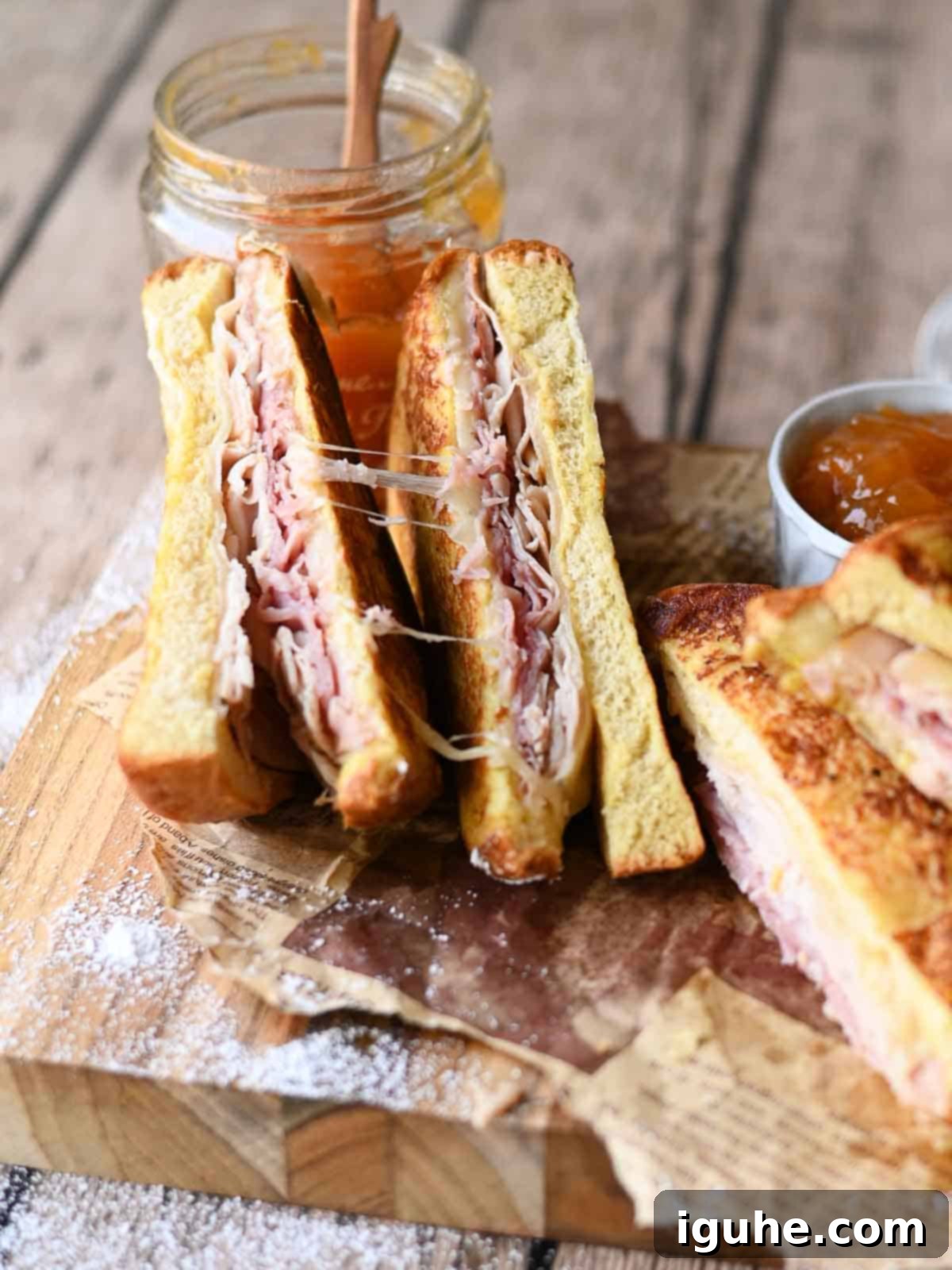 Monte Cristo sandwich cut open showing the cheesy filling and golden brown crust.